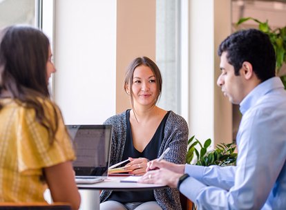 Group Of Colleagues At Table Together